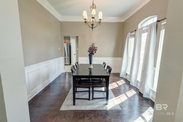 dining room featuring an inviting chandelier, dark hardwood / wood-style floors, and ornamental molding