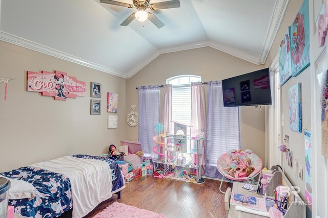 bedroom featuring vaulted ceiling, crown molding, hardwood / wood-style floors, and ceiling fan