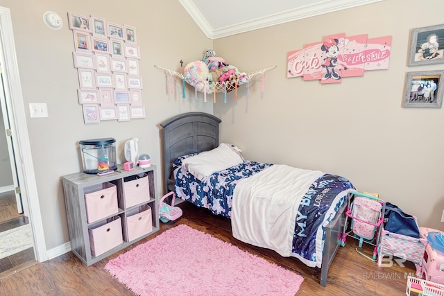 bedroom featuring wood-type flooring and crown molding