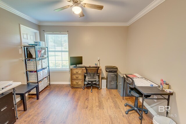 home office featuring hardwood / wood-style flooring, ceiling fan, and crown molding