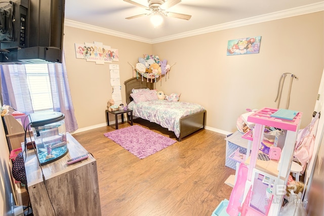 bedroom featuring ceiling fan, light hardwood / wood-style flooring, and ornamental molding