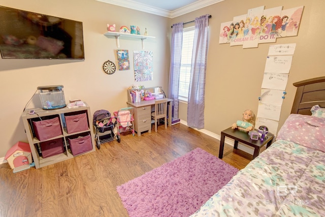 bedroom featuring ornamental molding and wood-type flooring