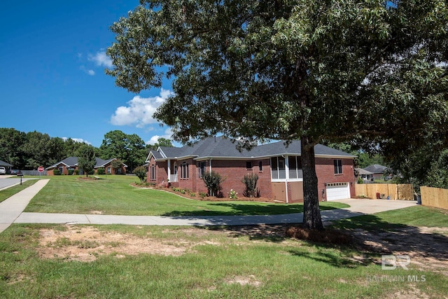 single story home with a garage and a front lawn