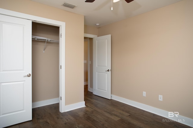 211 Lakefront Cir, Summerdale, AL 36580 - unfurnished bedroom featuring dark wood finished floors, baseboards, a closet, and ceiling fan