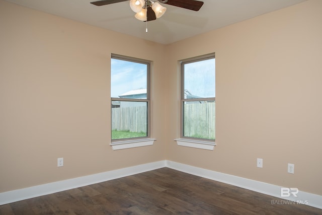 211 Lakefront Cir, Summerdale, AL 36580 - unfurnished room with a ceiling fan, baseboards, and dark wood-style flooring