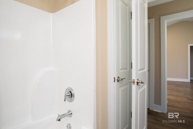 211 Lakefront Cir, Summerdale, AL 36580 - full bath featuring washtub / shower combination, wood finished floors, and baseboards