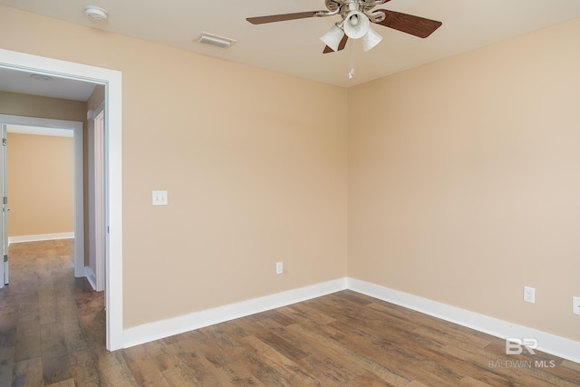 211 Lakefront Cir, Summerdale, AL 36580 - empty room featuring a smoke detector, a ceiling fan, dark wood finished floors, and baseboards