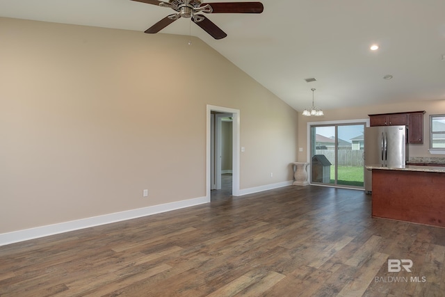 211 Lakefront Cir, Summerdale, AL 36580 - unfurnished living room featuring a ceiling fan, a chandelier, dark wood finished floors, high vaulted ceiling, and baseboards