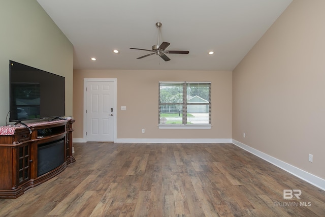 211 Lakefront Cir, Summerdale, AL 36580 - living area with vaulted ceiling, a ceiling fan, wood finished floors, recessed lighting, and baseboards