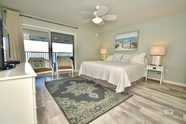 bedroom featuring access to outside, ceiling fan, and light wood-type flooring