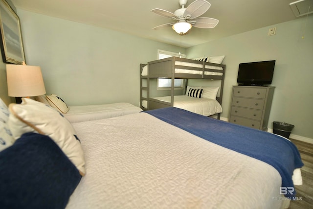 bedroom featuring dark hardwood / wood-style flooring and ceiling fan