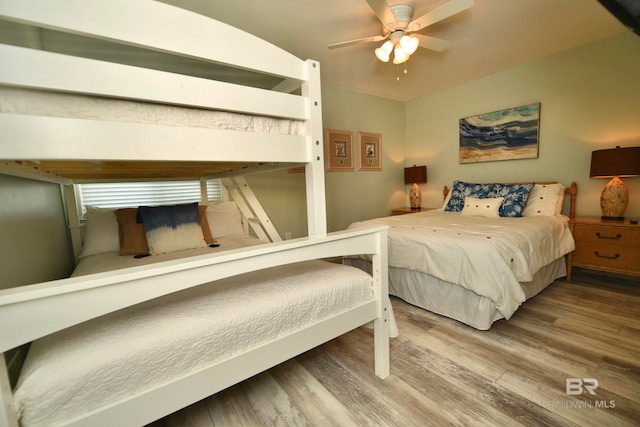 bedroom featuring hardwood / wood-style floors and ceiling fan