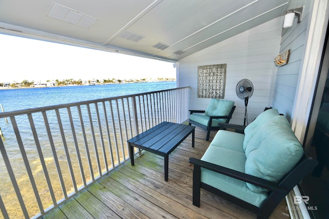 balcony featuring a water view