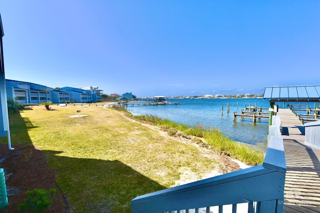 exterior space with a water view and a yard