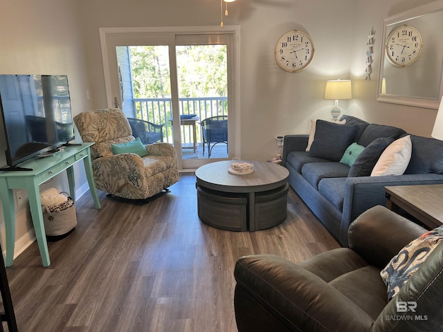 living room with wood finished floors and baseboards