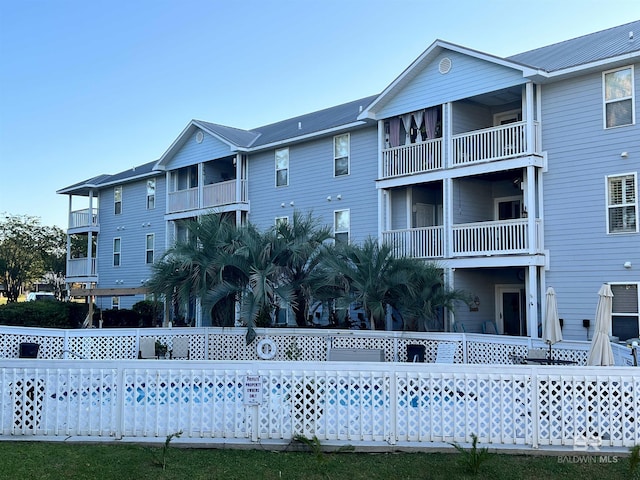 view of building exterior with fence