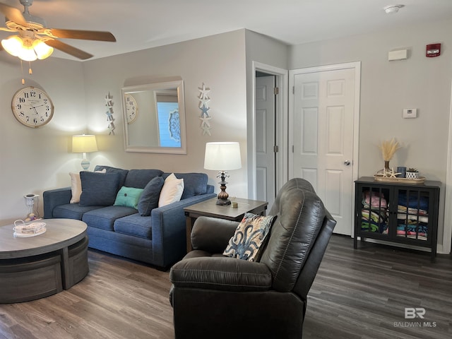 living area with ceiling fan and wood finished floors