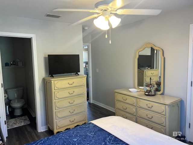 bedroom with ceiling fan, connected bathroom, visible vents, baseboards, and dark wood-style floors