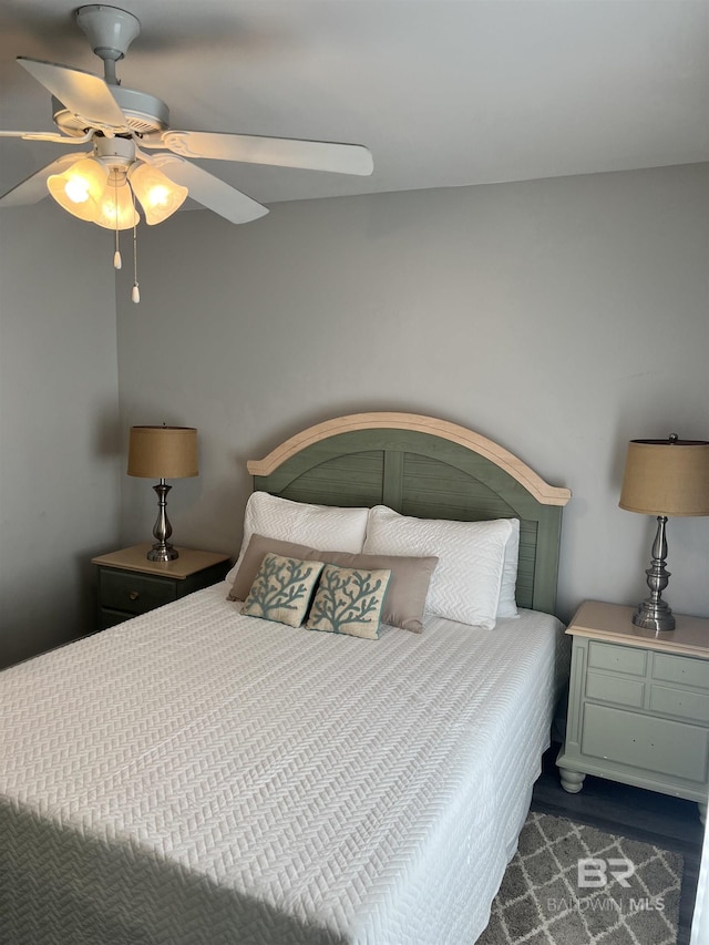 bedroom featuring a ceiling fan and wood finished floors