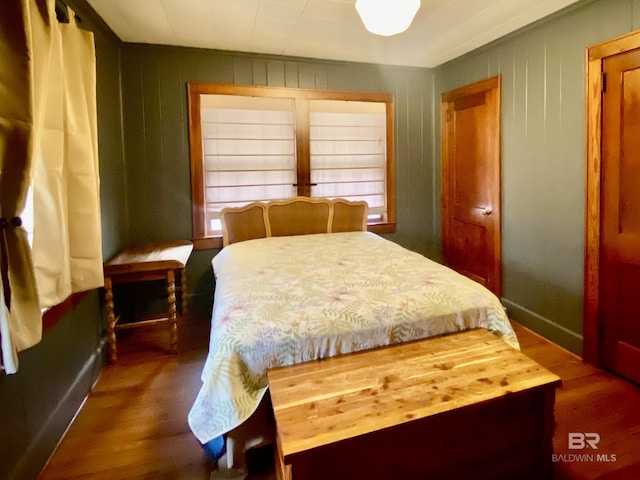 bedroom with wood finished floors