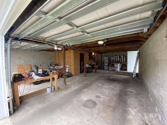 garage with concrete block wall