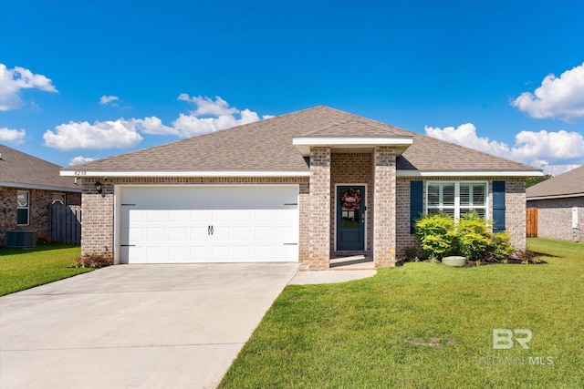 view of front of home with central air condition unit, a front yard, and a garage