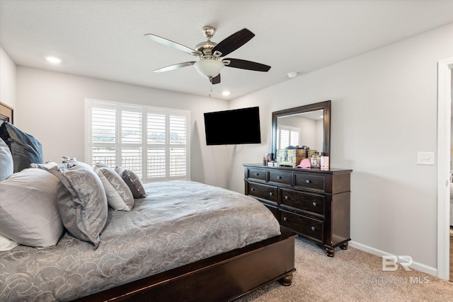 bedroom with light carpet and ceiling fan