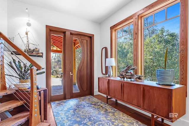 entryway featuring stairs and wood finished floors