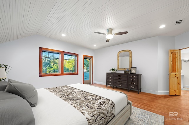 bedroom featuring vaulted ceiling, recessed lighting, wood finished floors, and baseboards