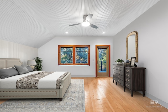 bedroom with baseboards, a ceiling fan, lofted ceiling, light wood-style flooring, and access to exterior