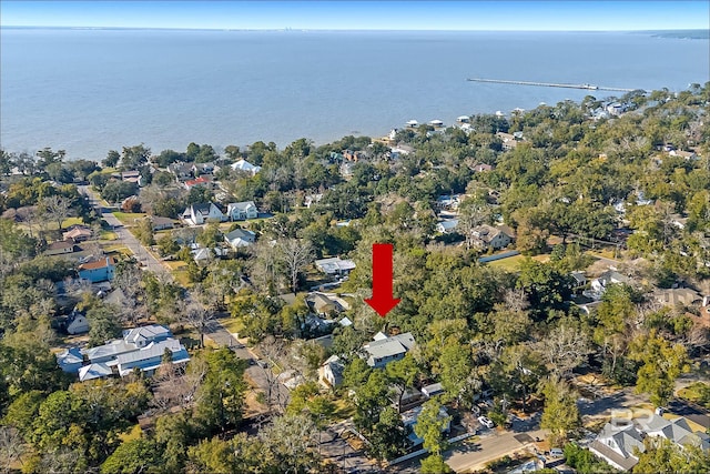 birds eye view of property featuring a water view and a residential view