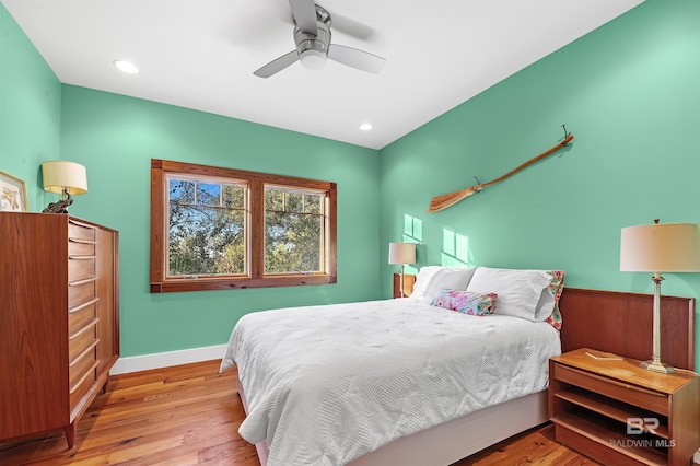 bedroom featuring recessed lighting, wood finished floors, a ceiling fan, and baseboards