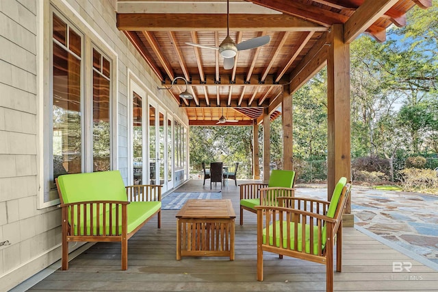 deck featuring ceiling fan and an outdoor living space