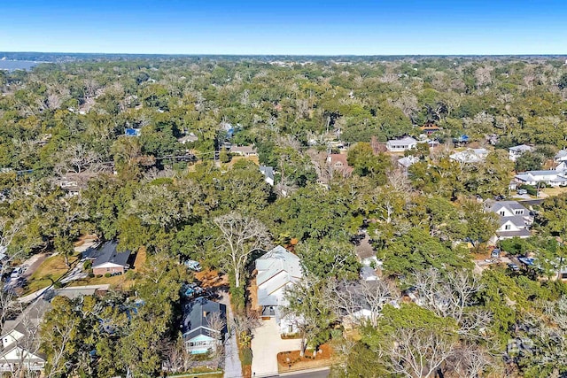 drone / aerial view with a forest view and a residential view