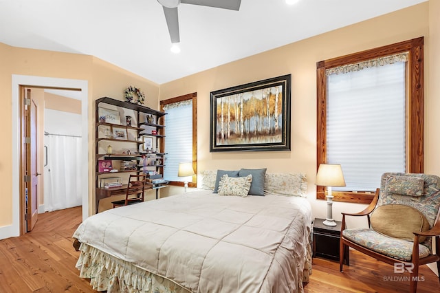 bedroom with baseboards, a ceiling fan, and wood finished floors