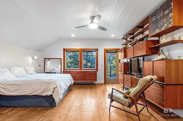 bedroom with access to outside, vaulted ceiling, light wood-style flooring, and recessed lighting