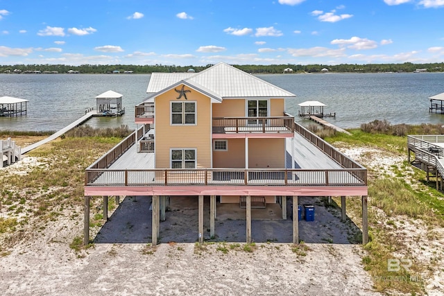 2024 W Beach Blvd, Gulf Shores, AL 36542 - back of house featuring a water view and a carport