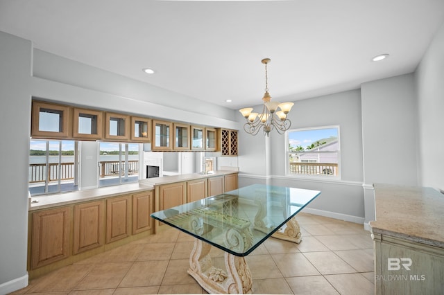 2024 W Beach Blvd, Gulf Shores, AL 36542 - dining space with a chandelier, light tile patterned flooring, and recessed lighting