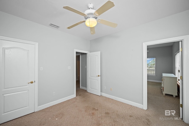 2024 W Beach Blvd, Gulf Shores, AL 36542 - unfurnished bedroom with carpet and a ceiling fan