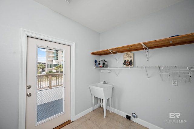 2024 W Beach Blvd, Gulf Shores, AL 36542 - washroom with baseboards