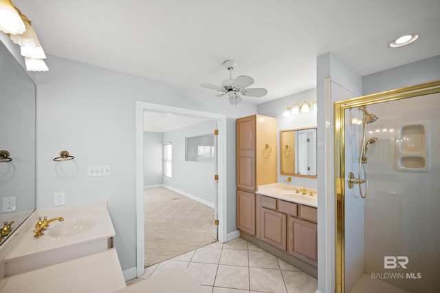 2024 W Beach Blvd, Gulf Shores, AL 36542 - bathroom with a shower stall, two vanities, a ceiling fan, and tile patterned flooring