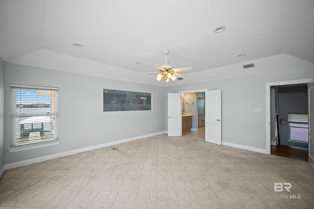 2024 W Beach Blvd, Gulf Shores, AL 36542 - unfurnished bedroom with light carpet, ensuite bath, recessed lighting, and a ceiling fan