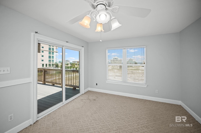 2024 W Beach Blvd, Gulf Shores, AL 36542 - carpeted empty room with ceiling fan and healthy amount of natural light