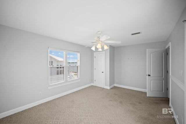 2024 W Beach Blvd, Gulf Shores, AL 36542 - unfurnished room featuring a ceiling fan and carpet