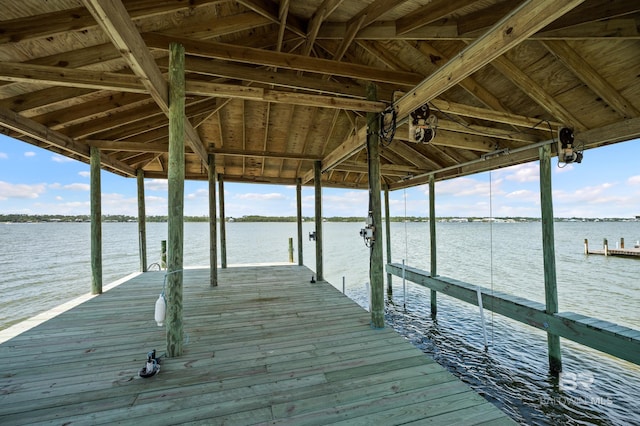 2024 W Beach Blvd, Gulf Shores, AL 36542 - dock featuring boat lift and a water view