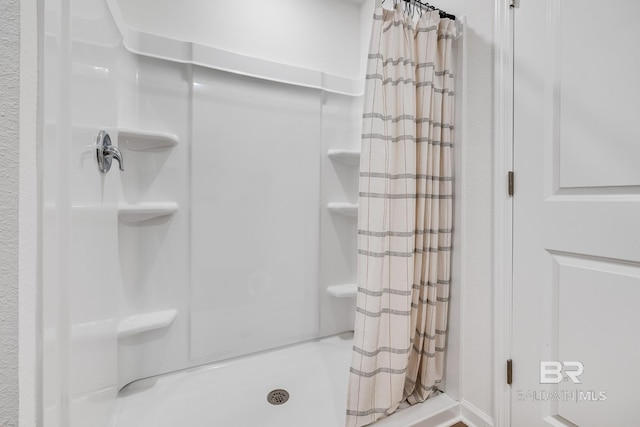 bathroom featuring a shower stall