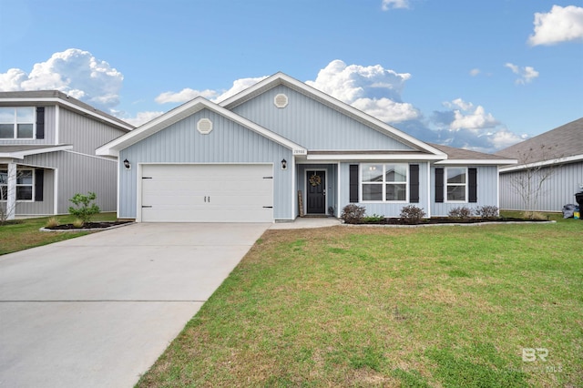 view of front of property featuring a garage, driveway, and a front yard