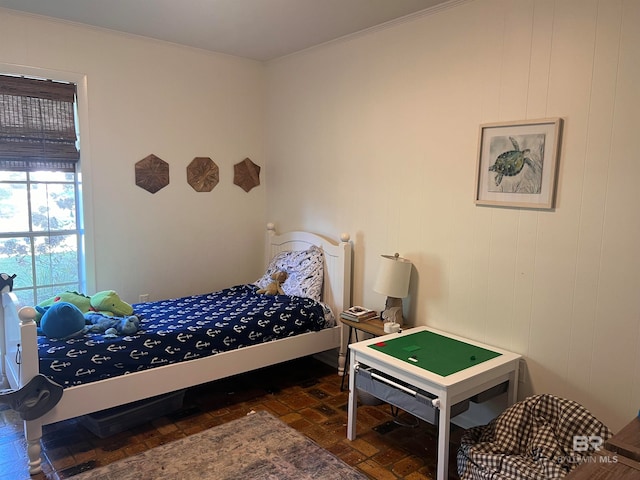 bedroom with ornamental molding