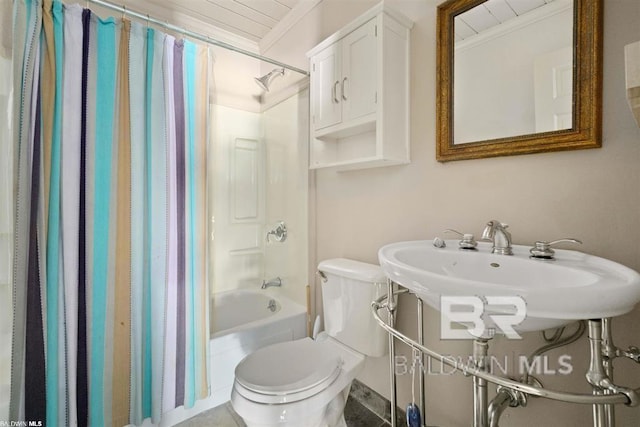 bathroom featuring crown molding, shower / bath combo, and toilet