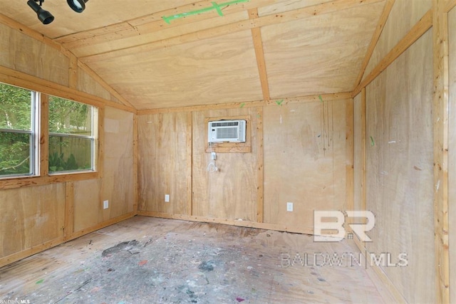 56 Deferriet Ct, Fairhope, AL 36532 - empty room featuring a wall unit AC and vaulted ceiling